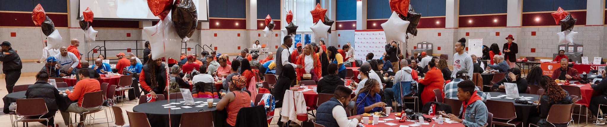 Alumni celebrating at tables