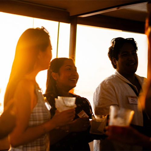 Images of alumni enjoying beverages in the sun