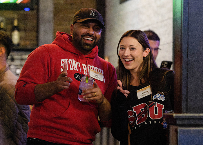 Two gold members enjoying a beverage