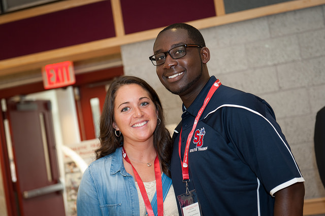 Two students smiling