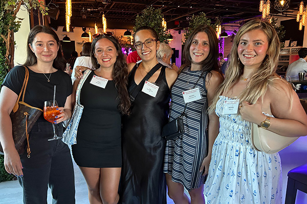 Five Stony Brook female Seawolves at a restaurant
