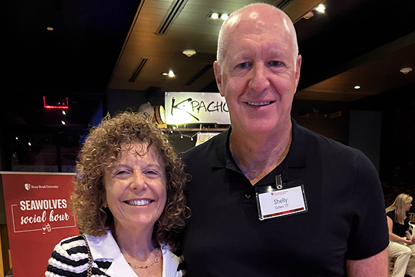 Man and woman at seawolf social hour event