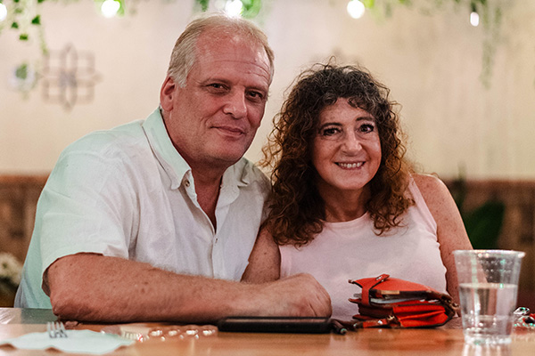Couple at Seawolf Social hour smiling