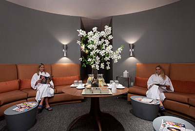 Image of two women relaxing in a spa lounge