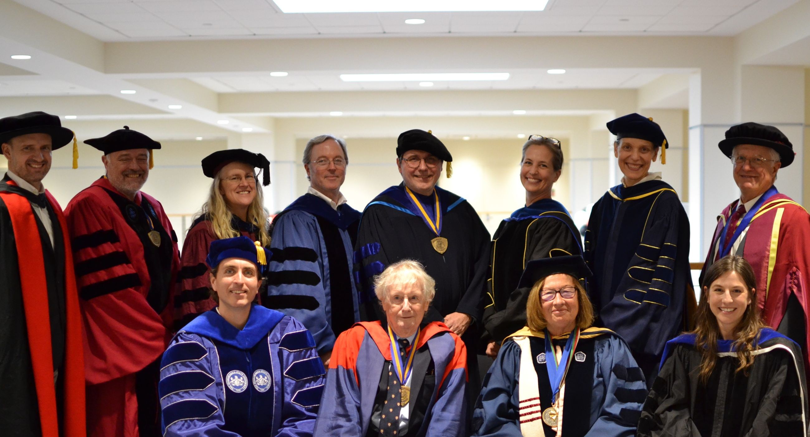 Anthropology faculty posing in regalia at a graduation ceremony