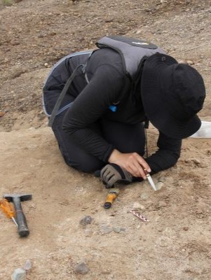 IDPAS student, Kristin Carline, excavating during the West Turkana Archaeological Project’s 2024 field season, led by her advisor Dr. Sonia Harmand.
