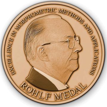The Rohlf Medal for Excellence in Morphometric Methods and Applications, which has an image of F. James Rohlf on the front.