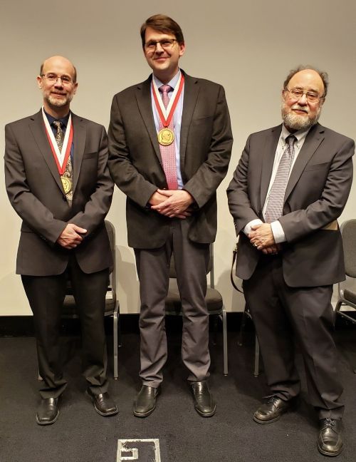 Group photograph of Dean C. Adams wearing his medal, Benedikt Hallgrimsson wearing his medal, and Fred L. Bookstein