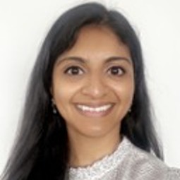 Southeast Asian woman with long black hair and dark brown eyes, shot cropped tight to face