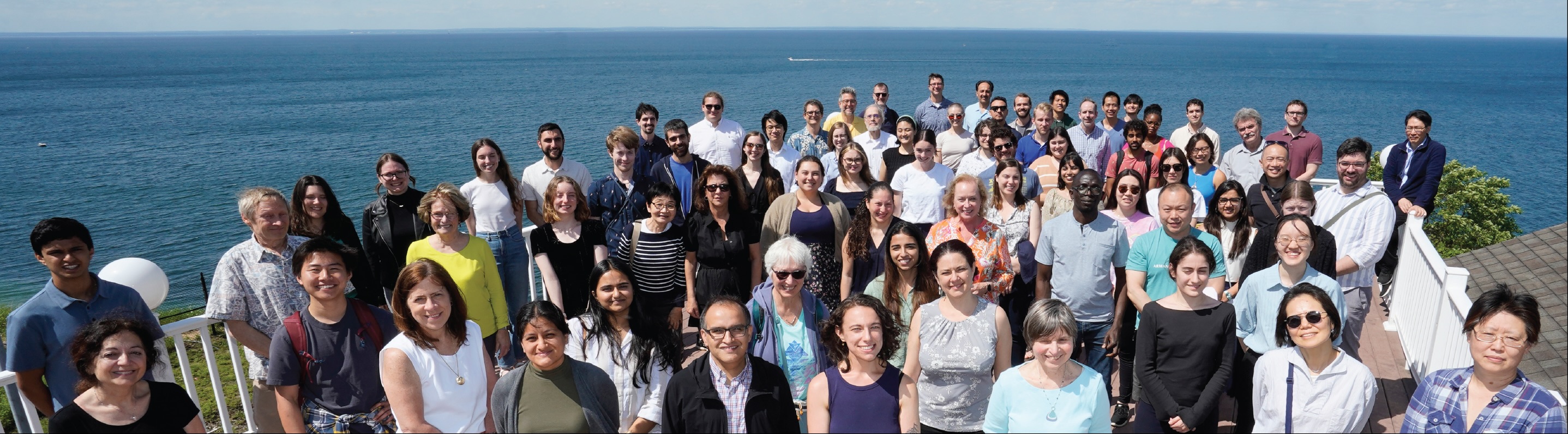 Members of the department at a retreat by the sound