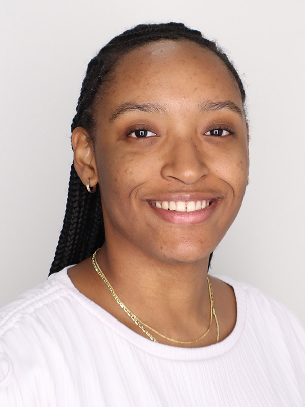 Student smiling at the camera
