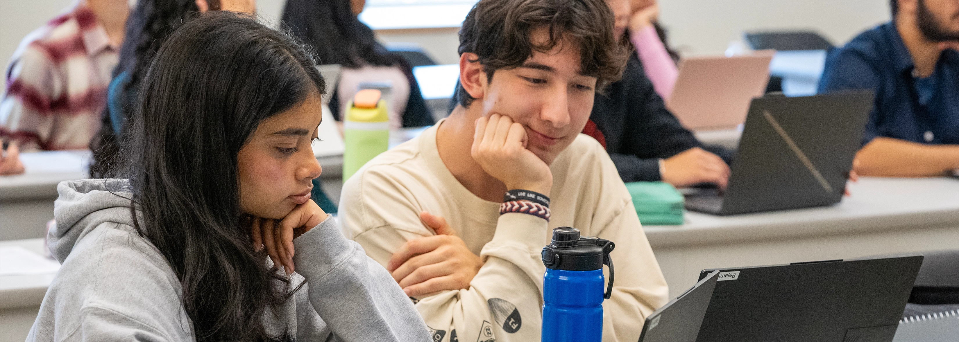 two students collaborating in class