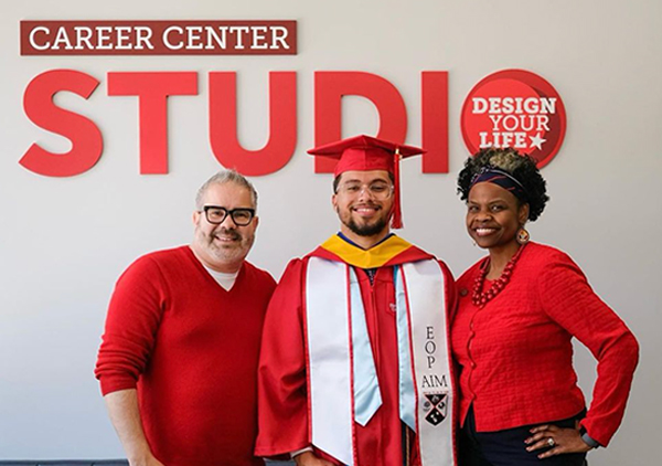 3 people standing in front of a Career Center Studio sign