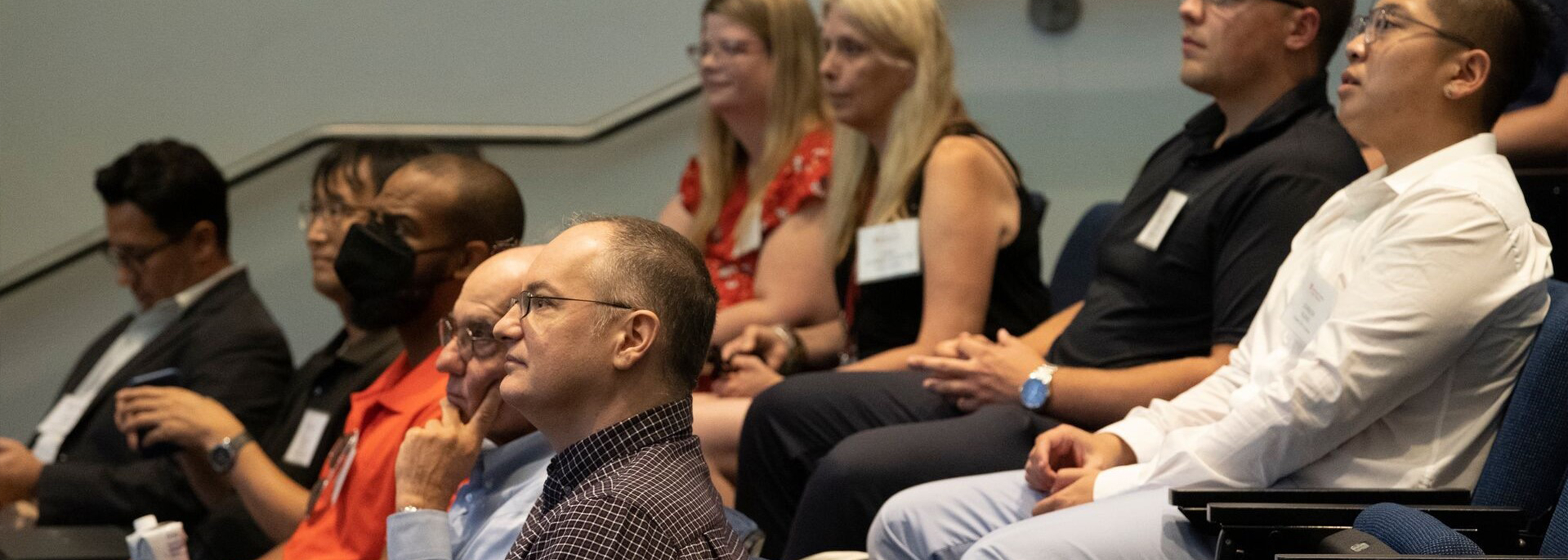 CoB faculty and students attending a seminar