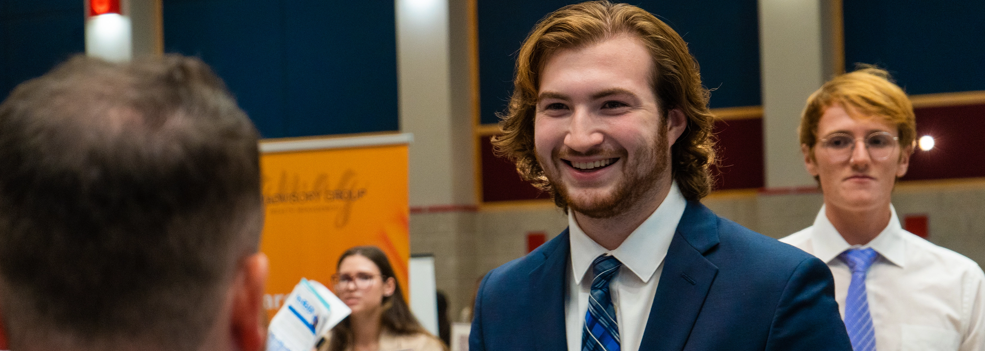 student at career fair networking
