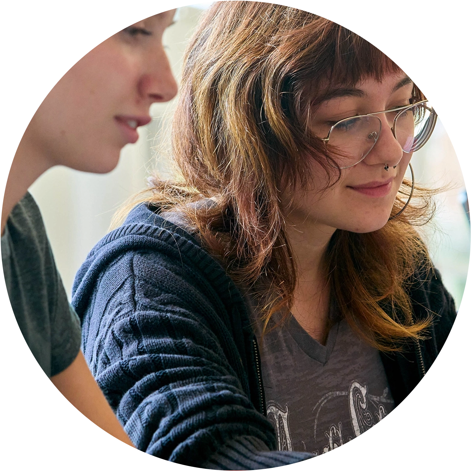 Two people focused on a task