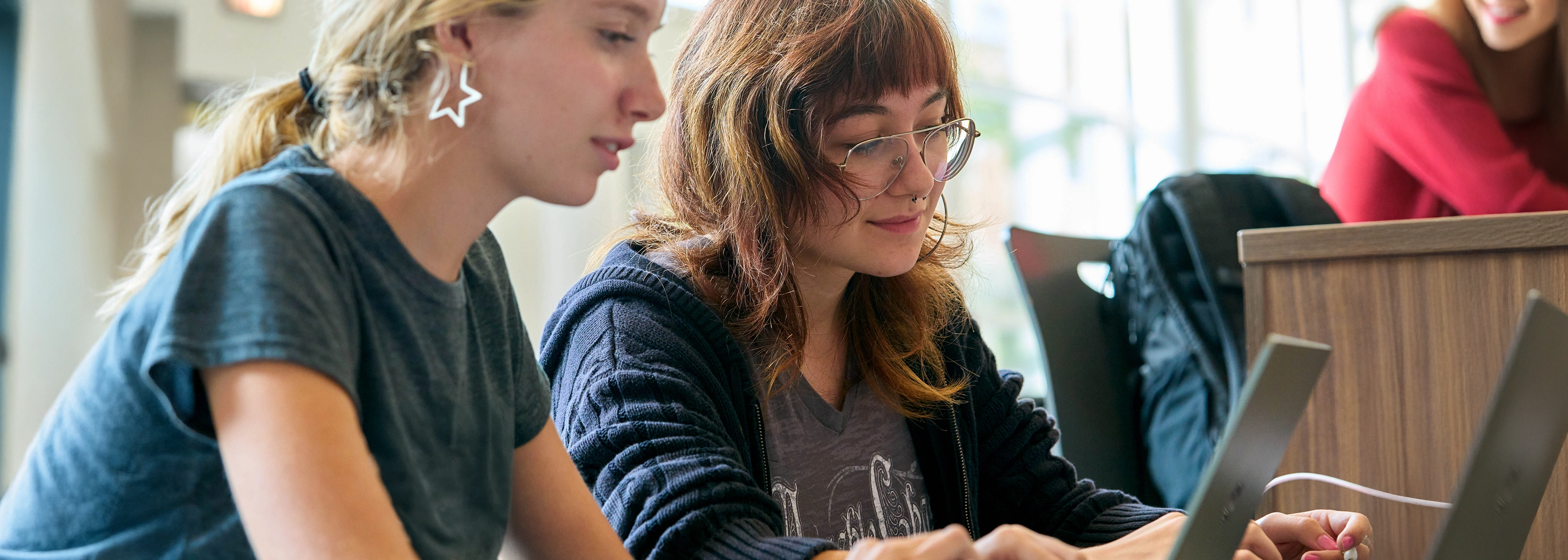 Two people focused on a task