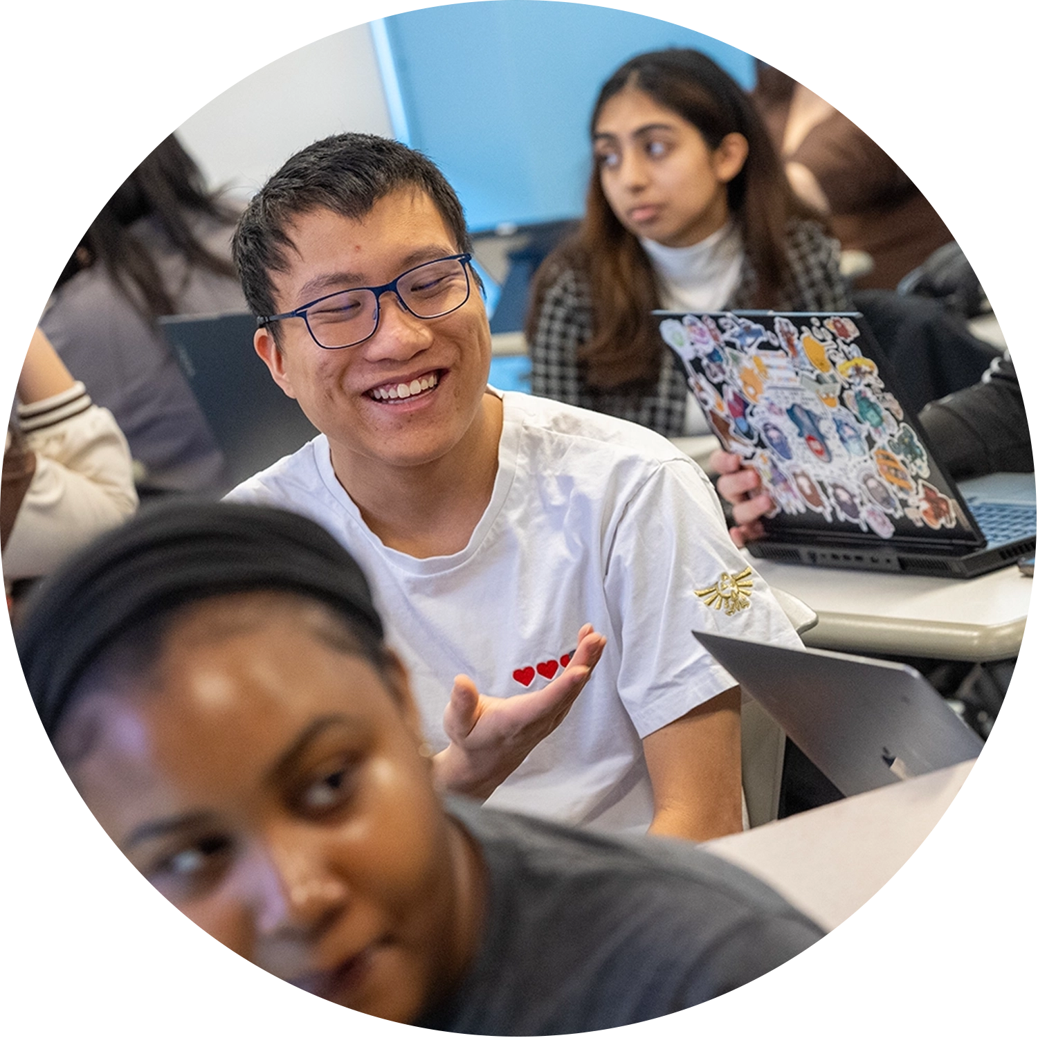 student smiling in a classroom