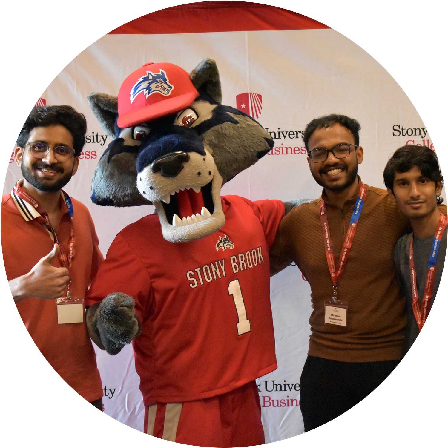 3 students with Wolfie mascot