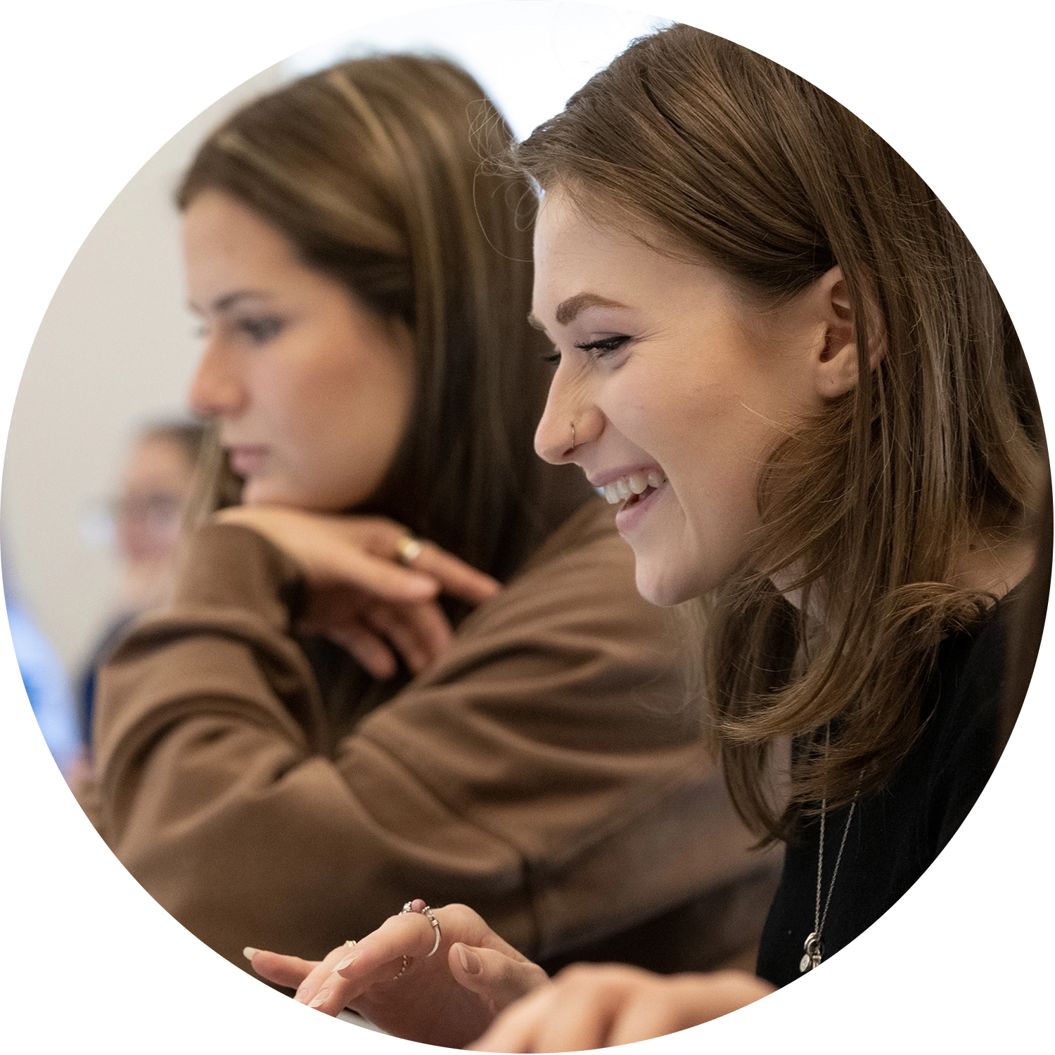 Graduate students collaborating in a classroom