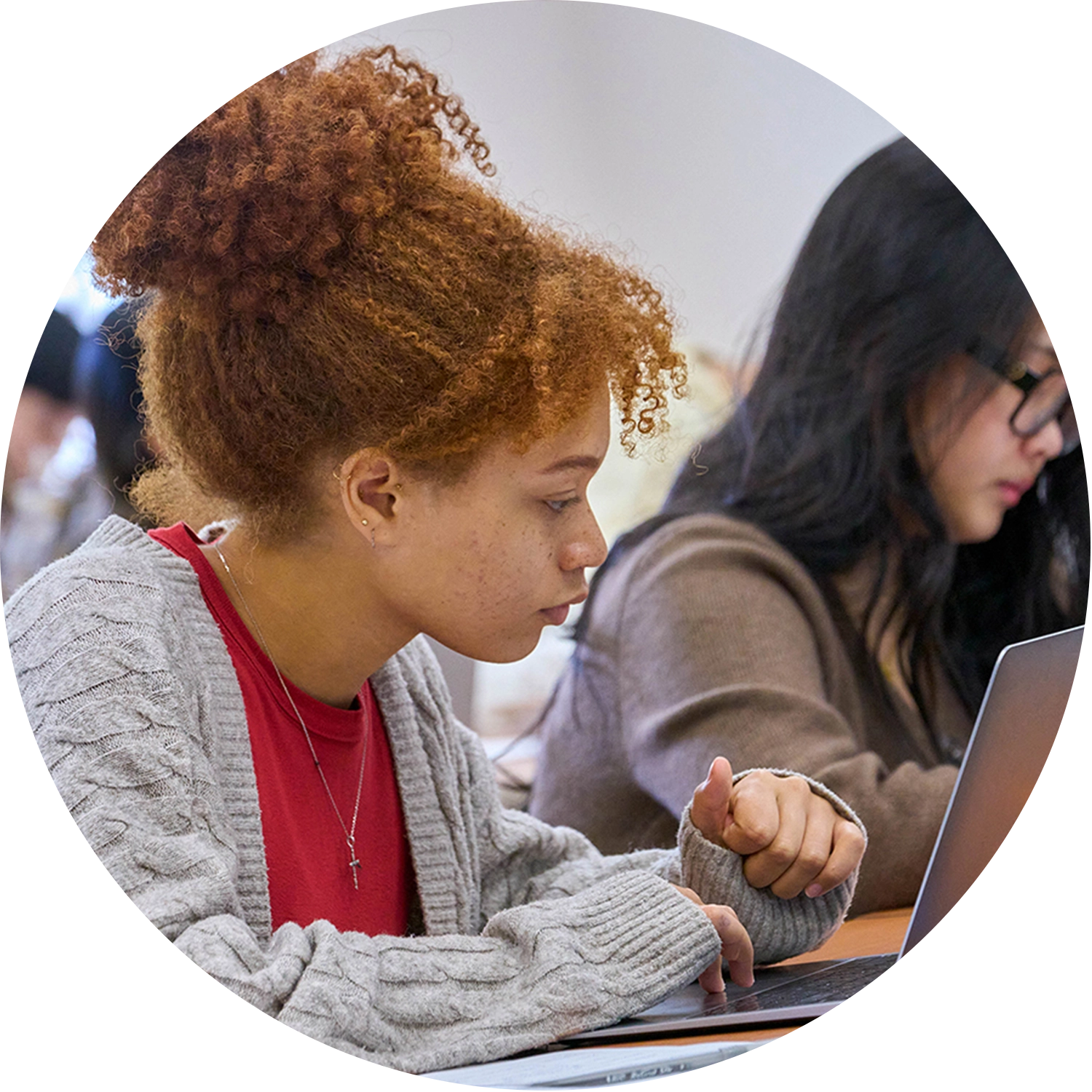 Two students focusing in class
