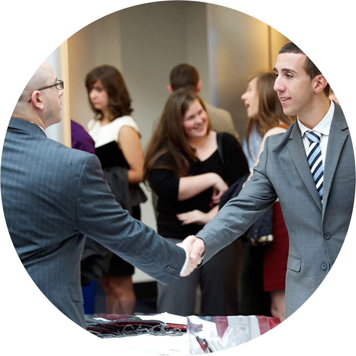 Graduate student networking at a business event