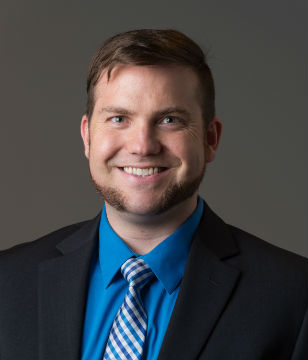 Headshot of Andrew Delton