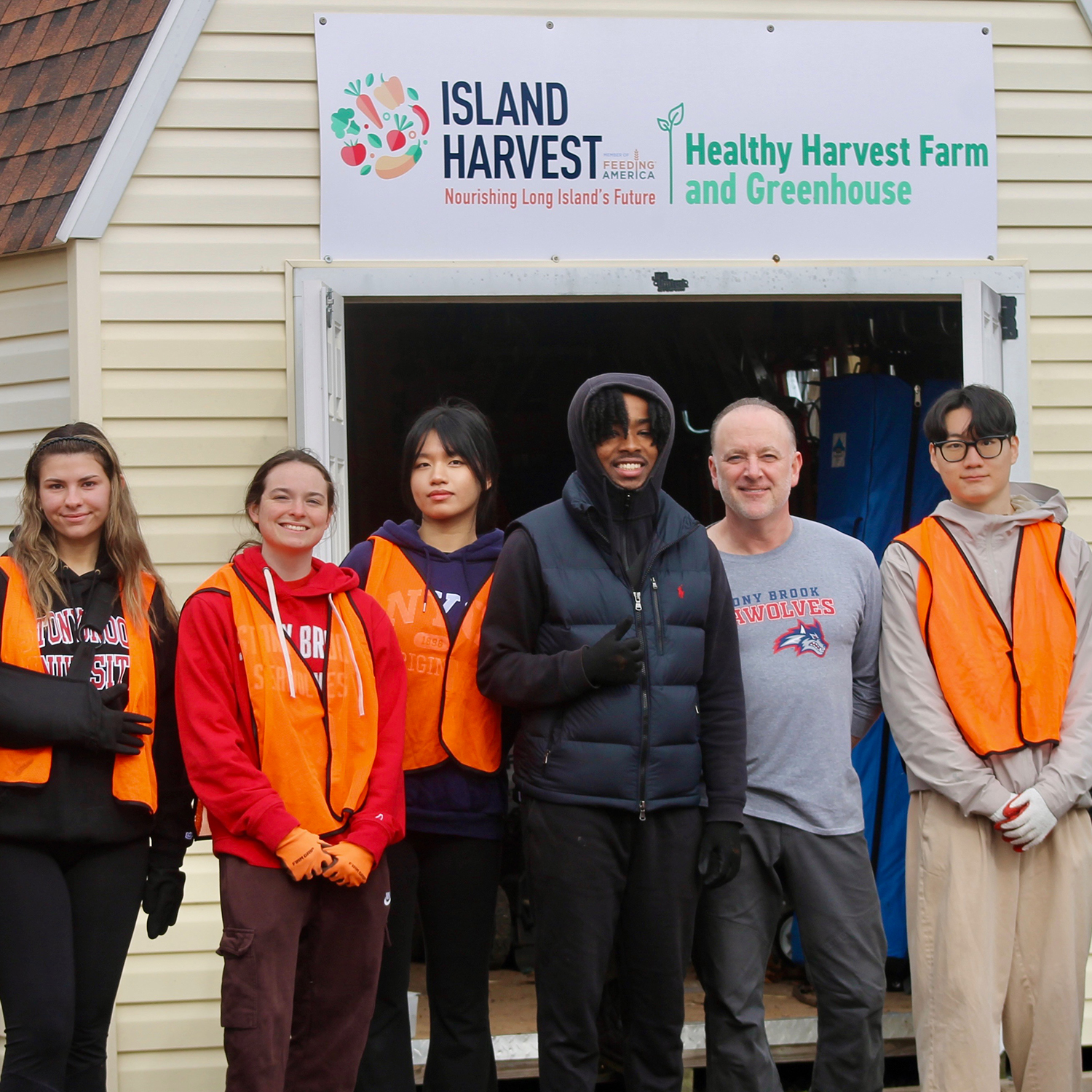students and faculty volunteering at Island Harvest