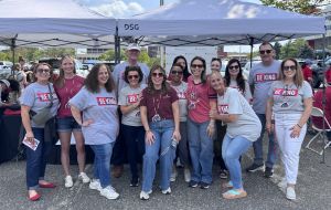 Dean's Office Tailgate Group of people wearing Be Kind Tshirts