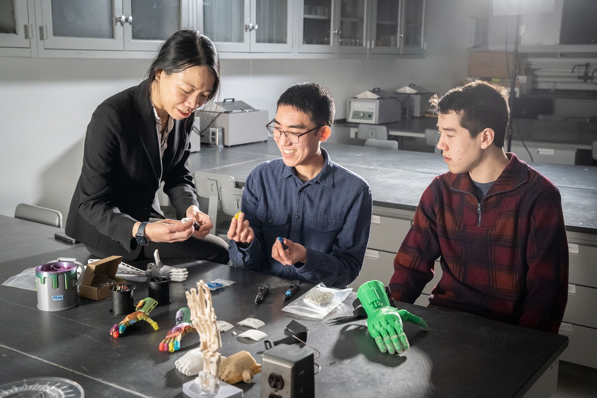 Professor and students sitting at a table
