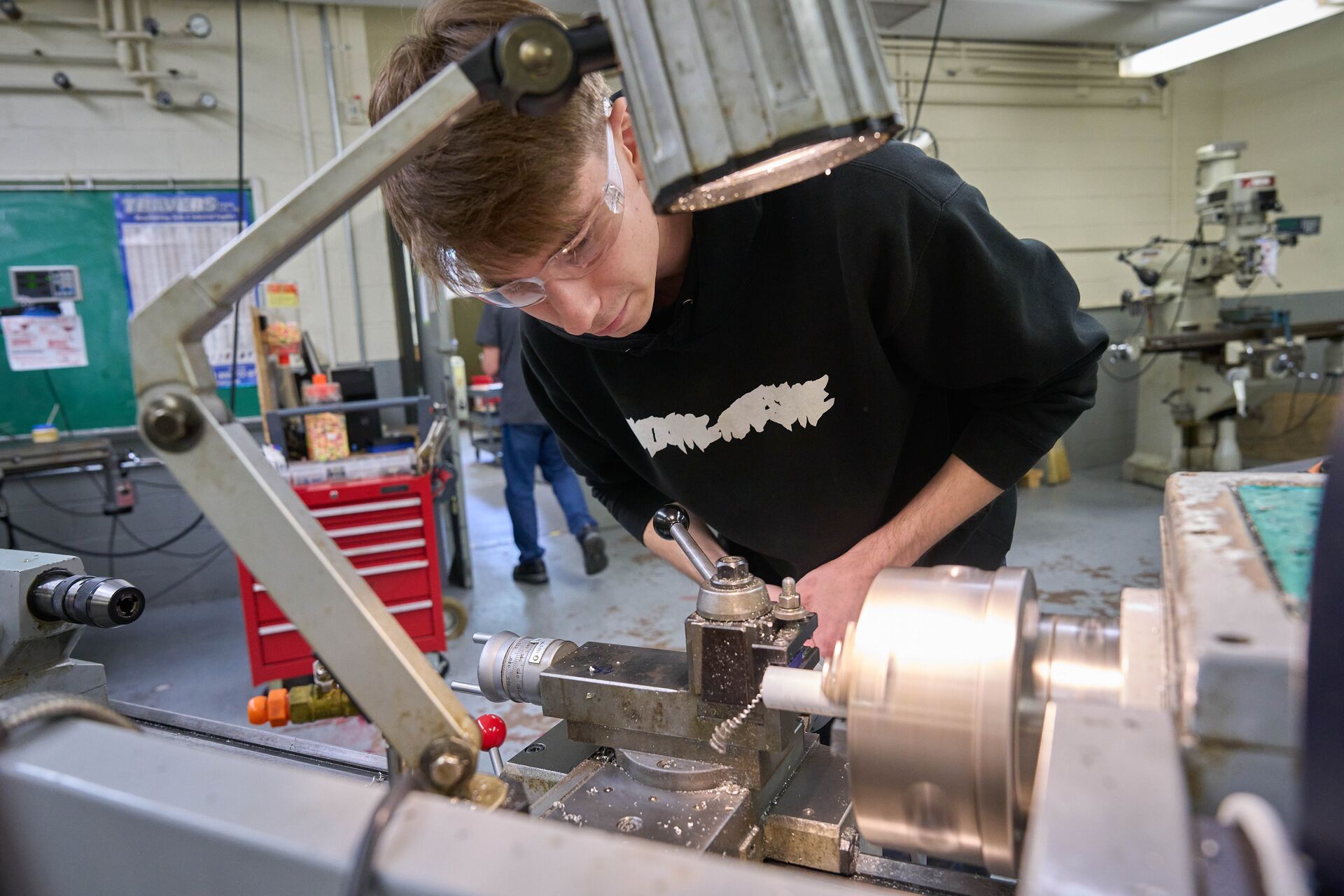Student working on a lathe.