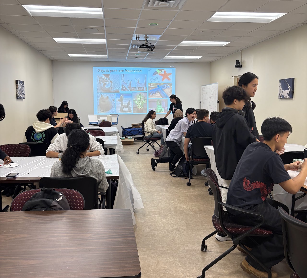 Event where students are working on 3D printing.