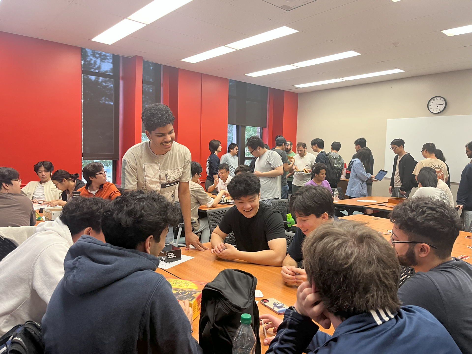 People sitting at a table smiling and laughing.