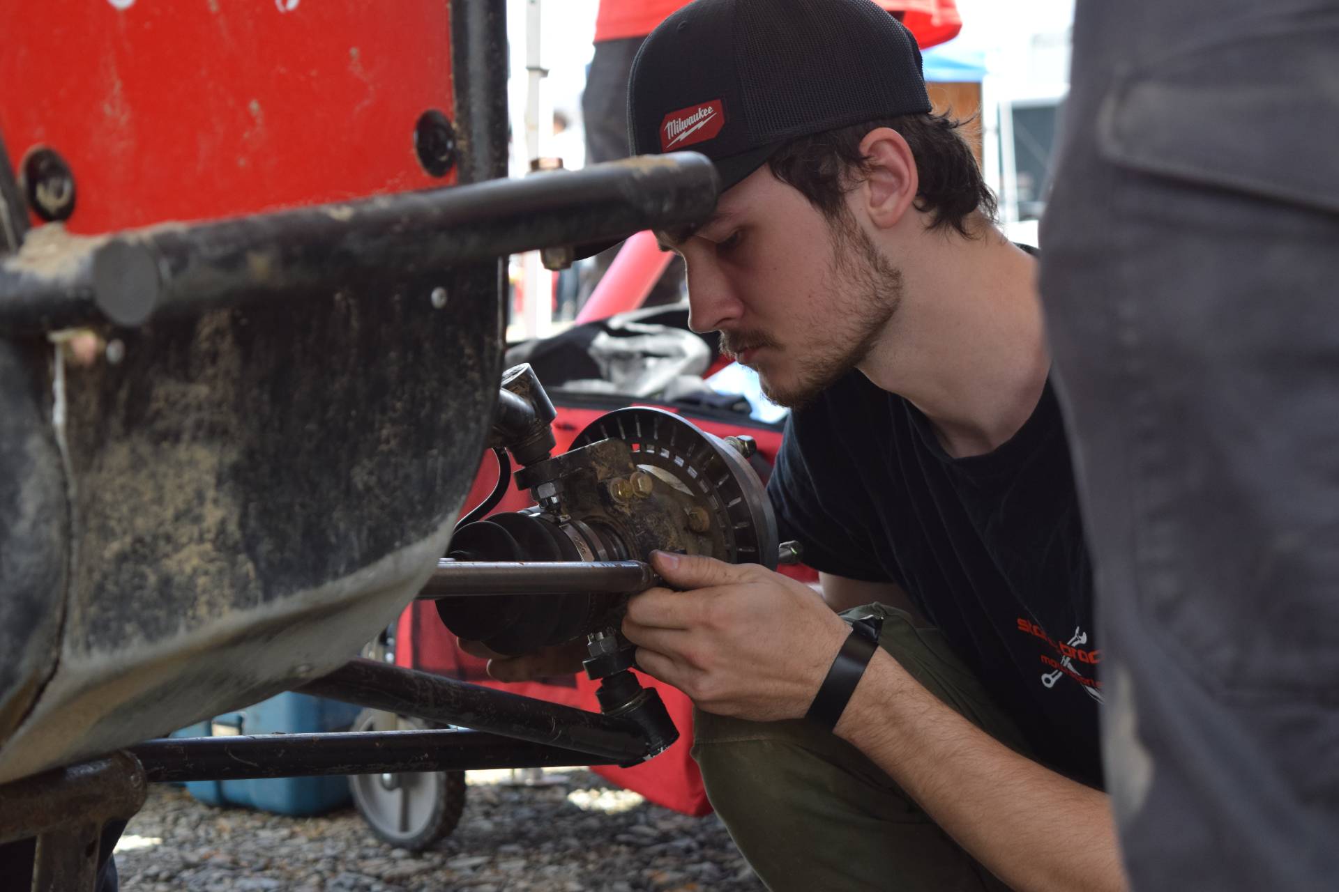 Person looking at equipment for a vehicle.