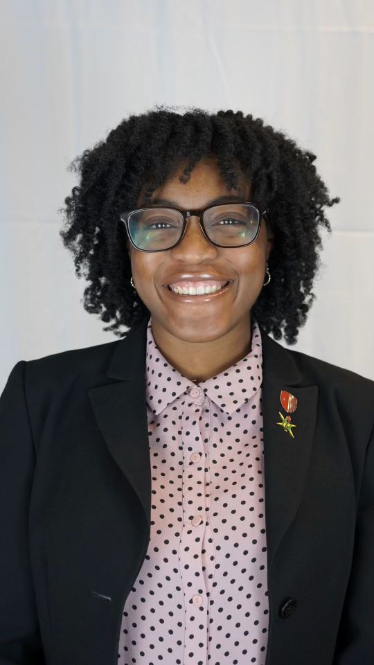 Olu Uwakwe smiling for a professional photo