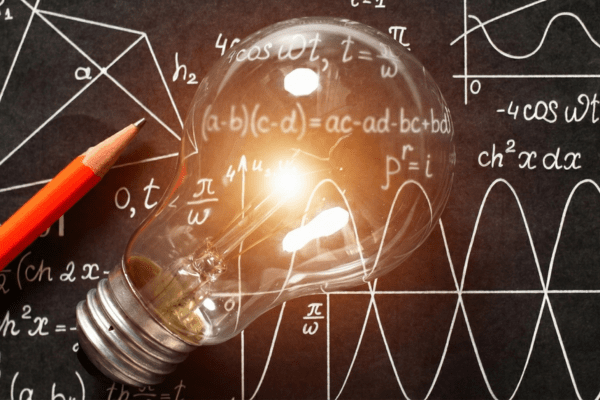 Applied Math and Statistics a red pencil, light bulb against a blackboard with mathematical problems in white chalk