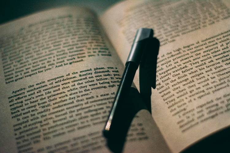 A pen on a book.
