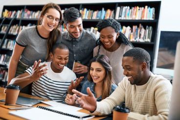 Students working on an assignment together at the library.
