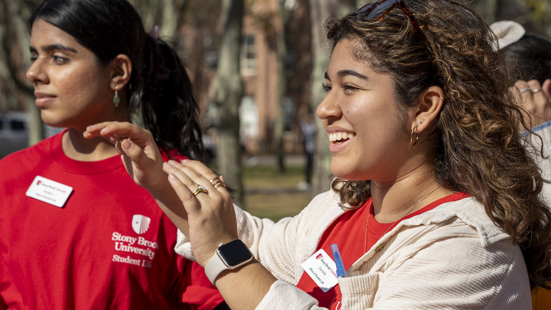 A student smiling while working for the Center for Civic Justice.