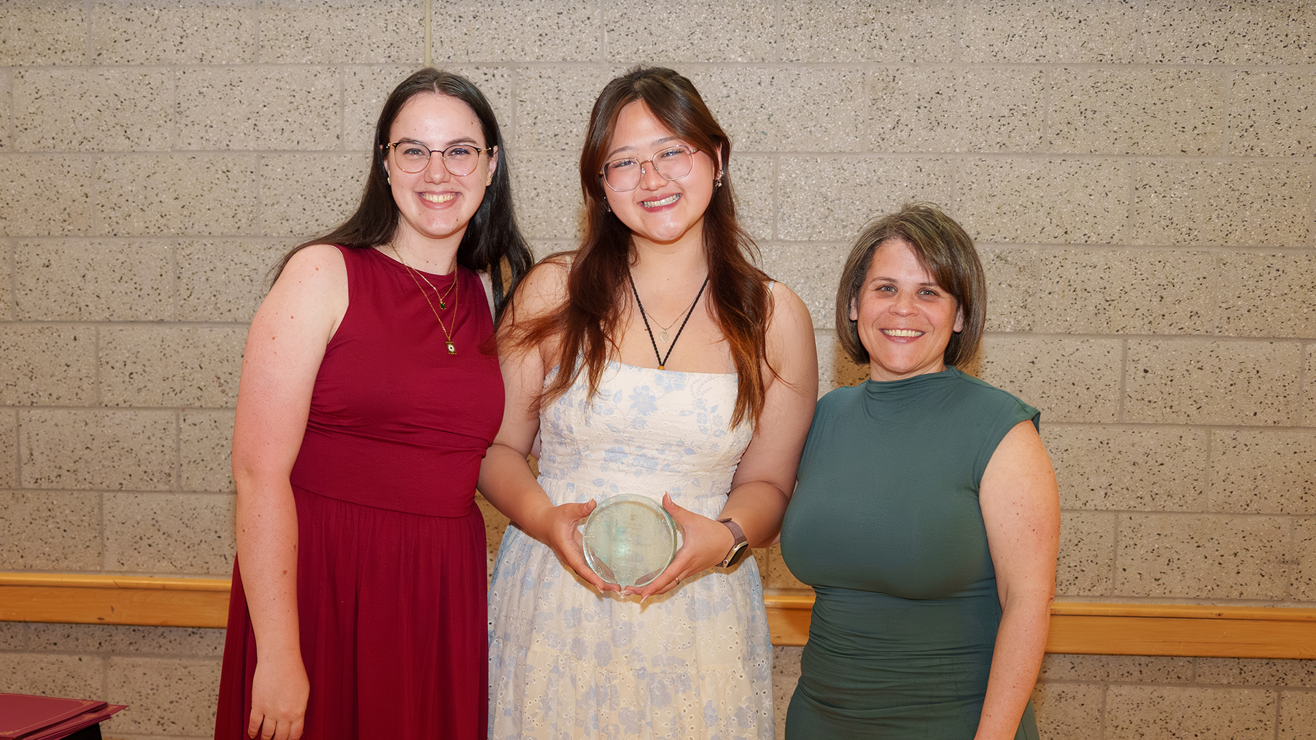 Student Life staff members posing with an award.