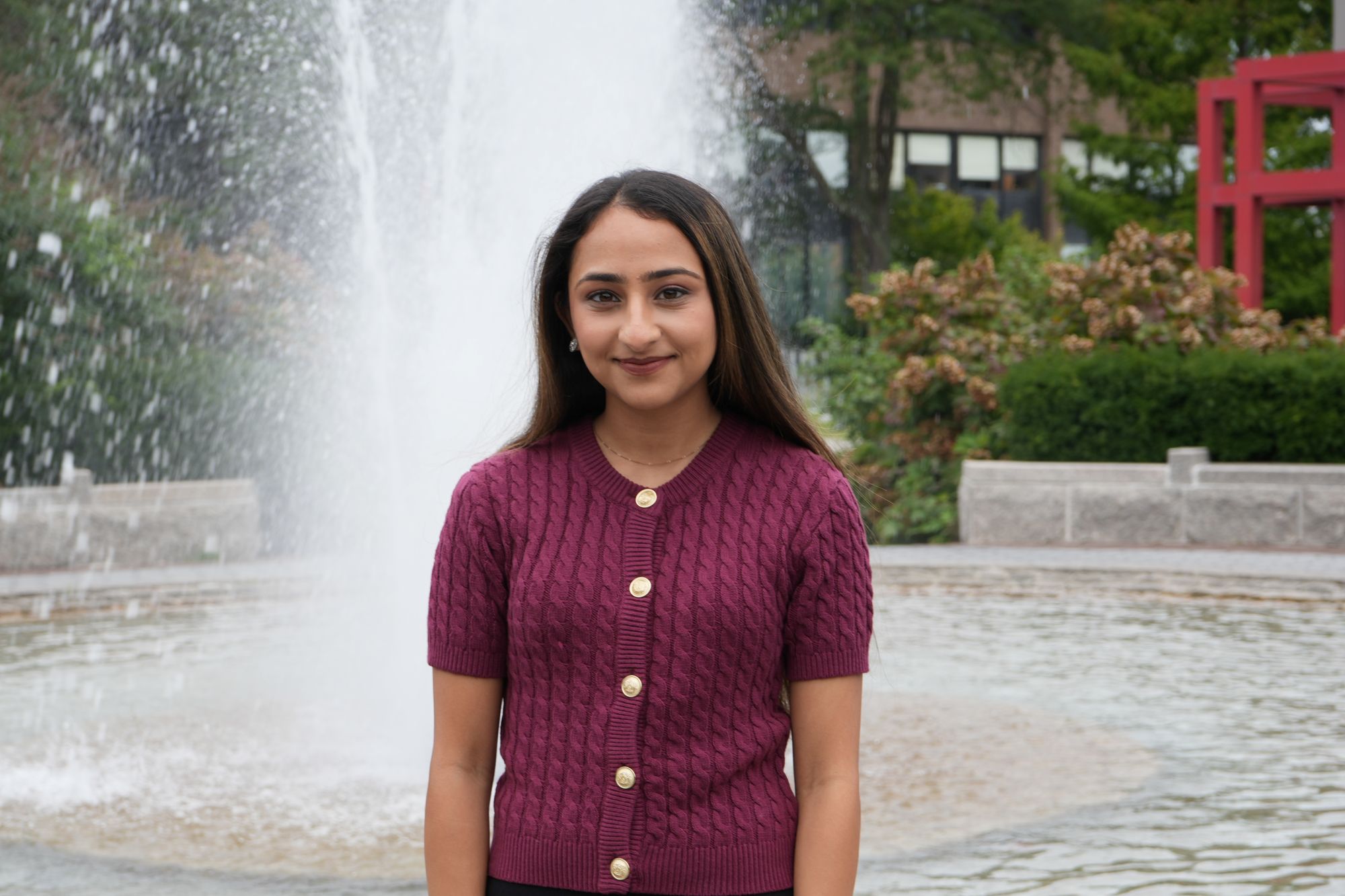 Laiba Rajput Person standing in front of a fountain outdoors