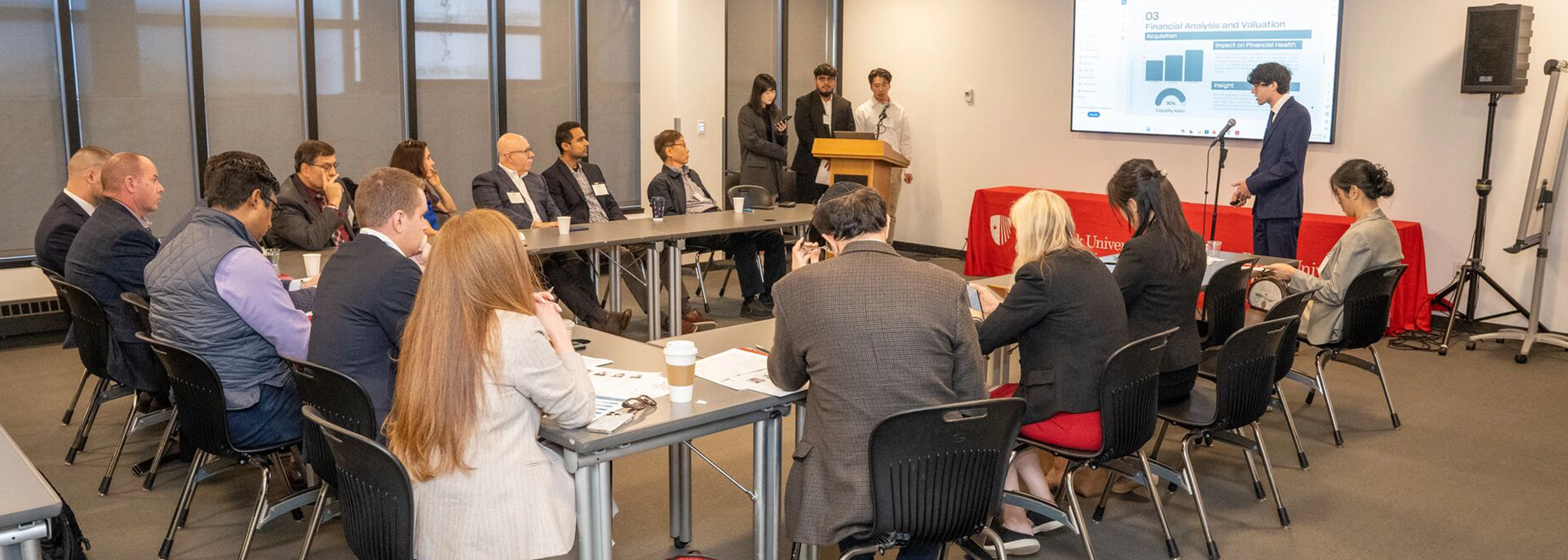 SUNY Stony Brook University College of Business Students at Convocation in their caps and gowns