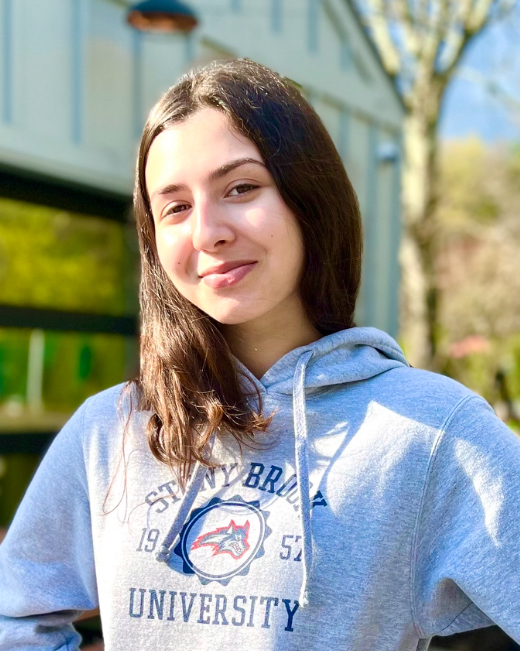Eva Supa, wearing a blue hoodie