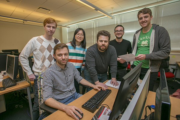 Professor Nikiforakis and his team of students collaborate in the PragSec lab in the New Computer Science building.