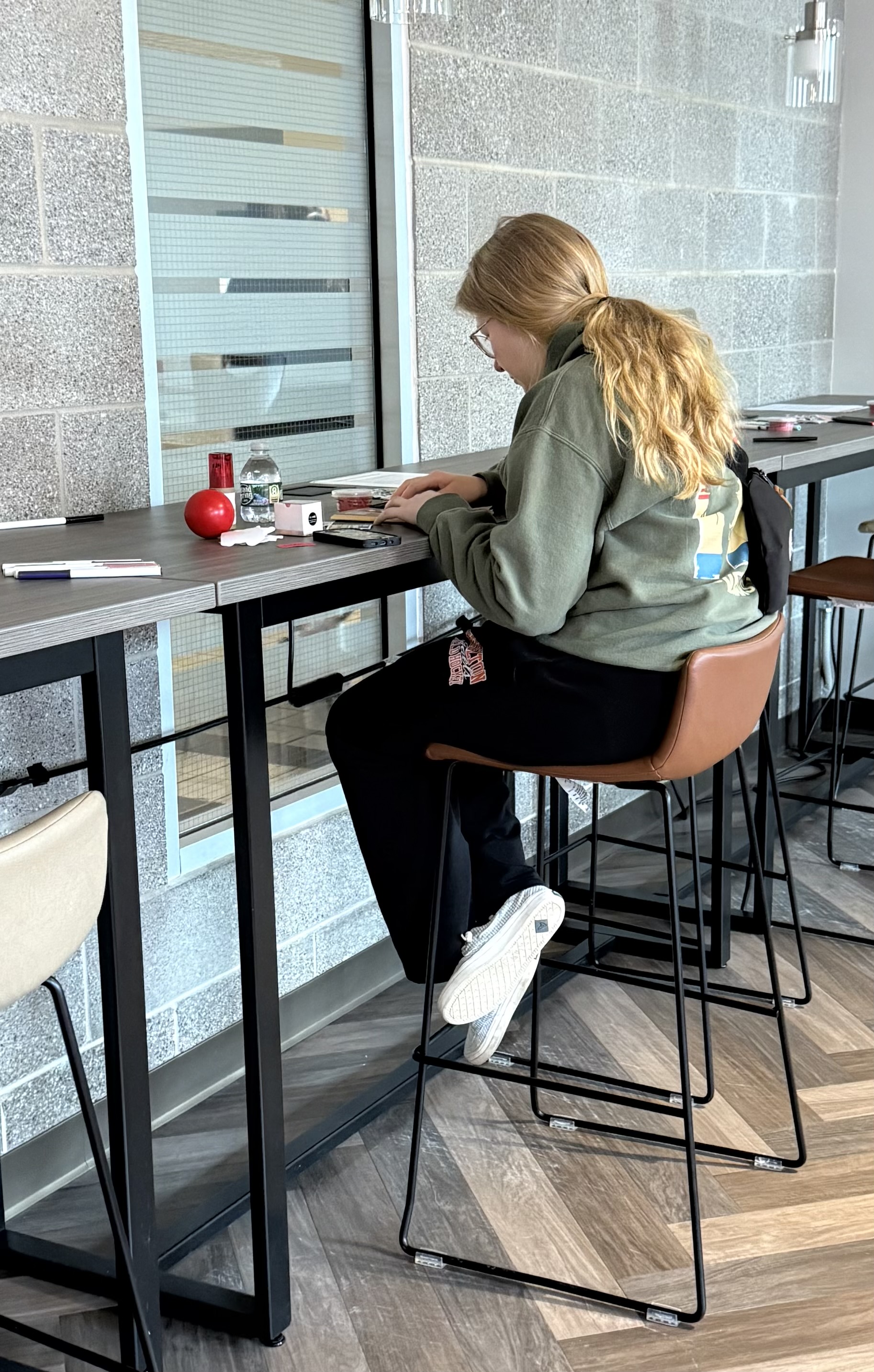 Student sitting in Graduate Student Lounge