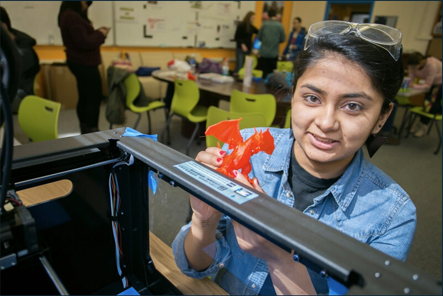 PCS Intro to Engineering PCS student holding 3D model