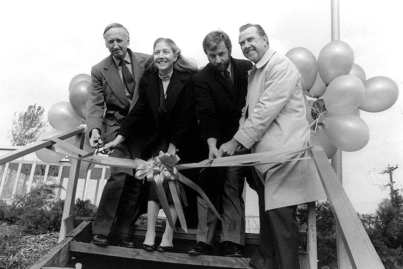 Southampton College chancellor Angier Biddle Duke, an unidentified woman, Tim Bishop and college president Edward C. Glanz in an undated ribbon cutting ceremony.