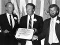 Southampton College chancellor Angier Biddle Duke (left) and provost Tim Bishop (right) present Southampton mayor William Hatrick with the Chancellors Award in 1986.