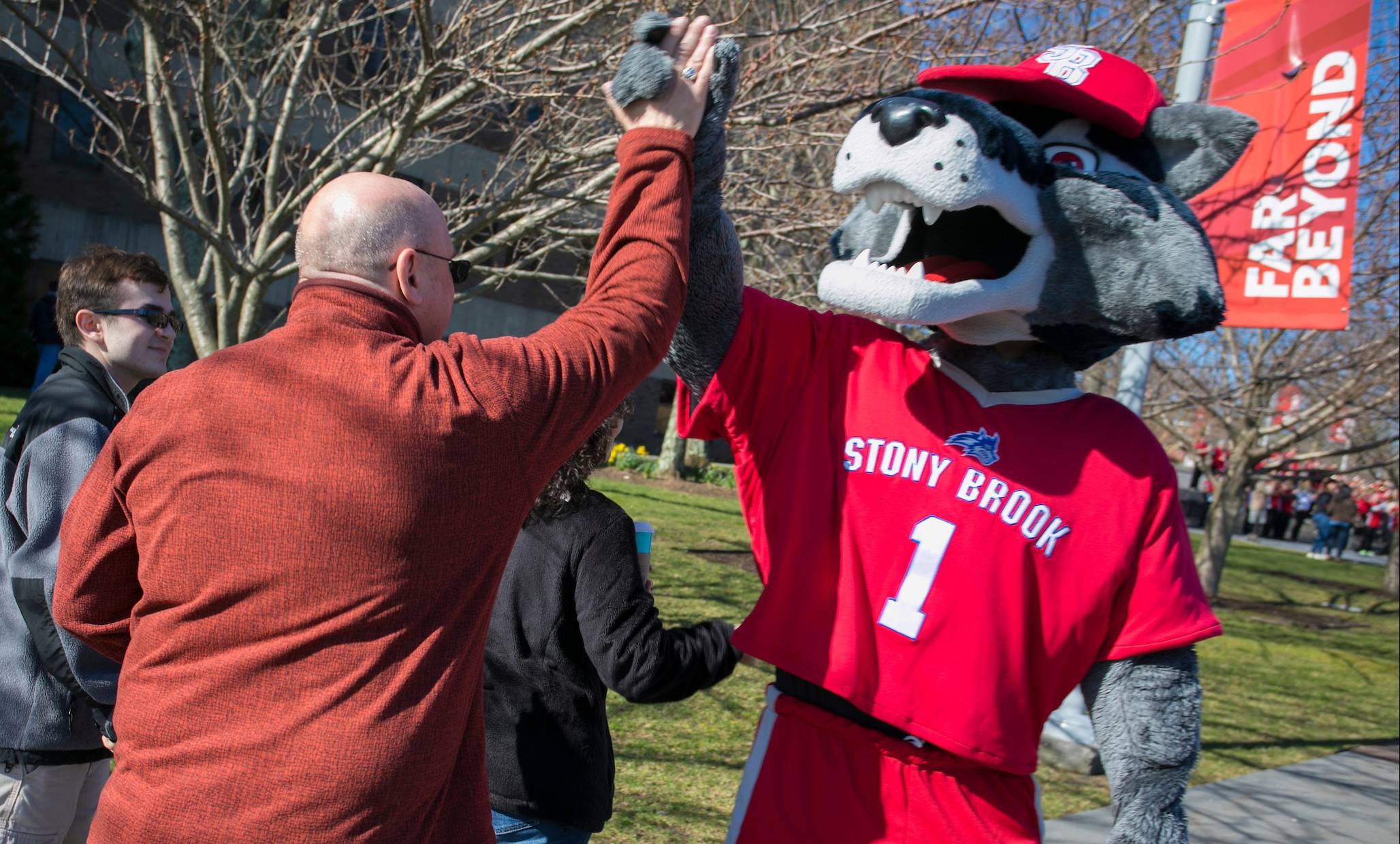 Wolfie giving high 5 to Seawolf parent