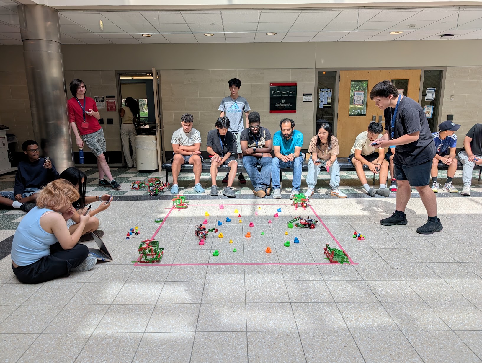 students playing with robots